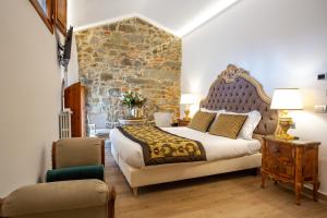 A bed or beds in a room at Residenza le Colline del Paradiso