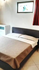 Postel nebo postele na pokoji v ubytování casa di arya CODICE CITRA LT-0043