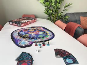 a white table with a board game on it at Good vibes Only apparts "So Zen" - 3 bedrooms - 8 pers - 20mn to Paris in Enghien-les-Bains