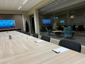 a large conference room with a long table and chairs at Frichs Ekspress Åndalsnes in Åndalsnes