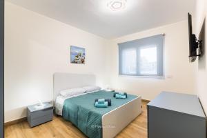 En eller flere senge i et værelse på House&Villas - Sea House