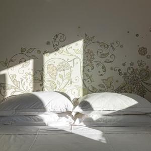 Rúm í herbergi á Albergo Minerva