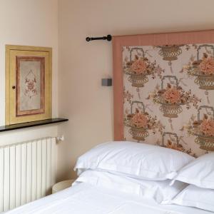 Rúm í herbergi á Albergo Minerva