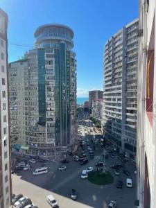 a view of a city with tall buildings at Family apartment in Batumi