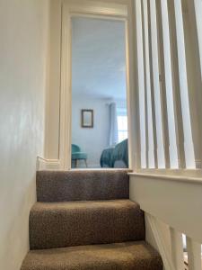 a staircase in a home with a stair case at Wesley Cottage in Middleham