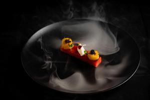 a plate with a piece of food on it at ibis Deira Creekside Dubai in Dubai