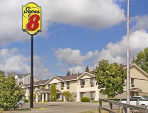 a sign for a super restaurant in front of a building at Super 8 by Wyndham Cloquet in Cloquet +15 photos