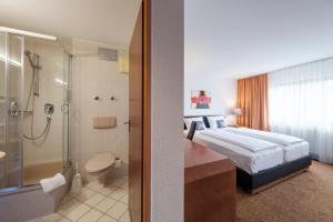 Baðherbergi á Hotel Flora Möhringen