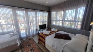 Postel nebo postele na pokoji v ubytování MEHMET BEY HOTEL
