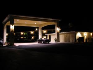 a car parked in front of a garage at night at River Terrace Inn in Green River