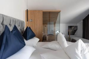 Posteľ alebo postele v izbe v ubytovaní Ansitz Battisti Suites