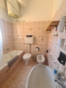 a bathroom with a tub and a toilet and a sink at Scel by PortofinoVacanze in Santa Margherita Ligure +62 photos