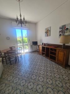 a living room with a table and a dining room at Scel by PortofinoVacanze in Santa Margherita Ligure