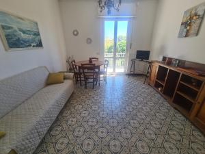 a living room with a couch and a table at Scel by PortofinoVacanze in Santa Margherita Ligure