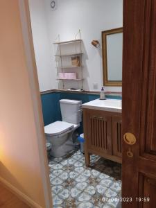 a bathroom with a toilet and a sink at la maison de josy in Aix-en-Provence