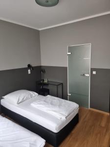 Postel nebo postele na pokoji v ubytování Hotel Fly ´ In