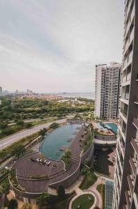 an aerial view of a pool in a city with buildings at 3 bedroom condo with Pool near Queensbay Mall in Bayan Lepas
