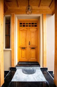 a wooden front door of a house at COSA Zeyrek- Home at the heart of Istanbul in Istanbul