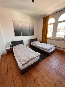 Ein Bett oder Betten in einem Zimmer der Unterkunft Ferienwohnung zur Altstadt