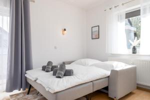 Postel nebo postele na pokoji v ubytování Harmony: Edersee Apartment – Sperrmauer – Lounge