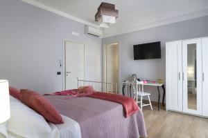 Posteľ alebo postele v izbe v ubytovaní Il Tempio di Athena - Cultura e Relax a Siracusa