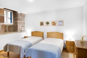 Ένα ή περισσότερα κρεβάτια σε δωμάτιο στο Casa Rio Contença T5 +16 φωτογραφίες