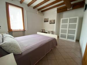 Postel nebo postele na pokoji v ubytování B&B Tenuta Le Rondini