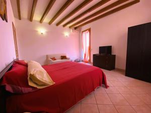 Postel nebo postele na pokoji v ubytování B&B Tenuta Le Rondini