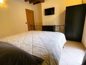 Postel nebo postele na pokoji v ubytování B&B Tenuta Le Rondini