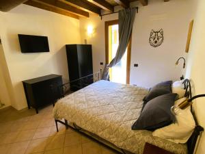 Postel nebo postele na pokoji v ubytování B&B Tenuta Le Rondini