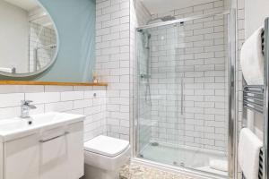 a bathroom with a shower and a toilet and a sink at Heart of Aberdeen * Ground Floor in Aberdeen