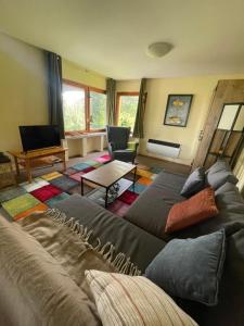 a living room with two beds and a couch at Ferienhaus Silvaner in Naumburg