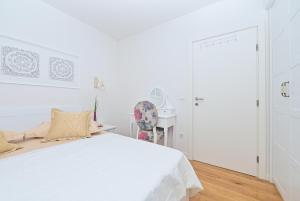 Postel nebo postele na pokoji v ubytování Apartment Đaninovica II