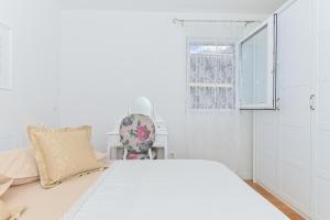 Postel nebo postele na pokoji v ubytování Apartment Đaninovica II