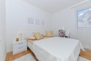 Postel nebo postele na pokoji v ubytování Apartment Đaninovica II + 37 fotografií