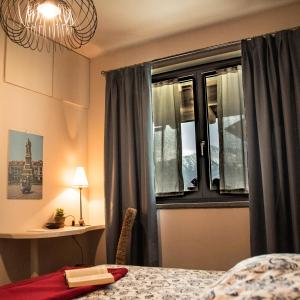 Postel nebo postele na pokoji v ubytování B&B Belelì Daramba