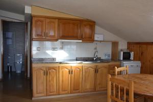 Una cocina o zona de cocina en Apartamentos SNÖ Edelweiss