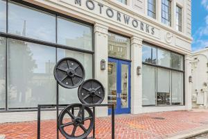 a metal sculpture in front of a store at Roami at Motorworks in New Orleans
