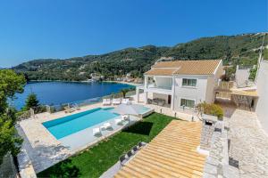 an aerial view of a house with a swimming pool at Kalami Beach - Villa Mara in Kalami