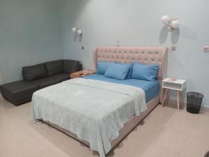 Postel nebo postele na pokoji v ubytování Oasis Lawafossi