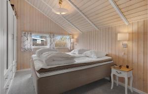 a large bed in a room with a window at Gorgeous Home In Slagelse With Sauna in Slagelse +24 photos