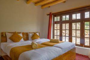 Postel nebo postele na pokoji v ubytování Likir Pottery Homestay - Likir Village - Sham Valley