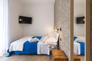 Posteľ alebo postele v izbe v ubytovaní Il Tempio di Athena - Cultura e Relax a Siracusa