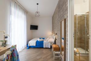 Posteľ alebo postele v izbe v ubytovaní Il Tempio di Athena - Cultura e Relax a Siracusa