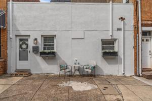 a table and two chairs in front of a building at East Passyunk Trendy Apartment in Philadelphia