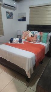 En eller flere senge i et værelse på Casita Playera Aguadeña