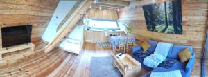 an aerial view of a living room and kitchen in a log cabin at Świronek in Białowieża