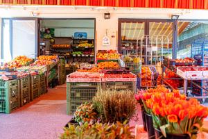 a grocery store filled with lots of fruits and vegetables at My city apartment - Vienna CityRoom in Vienna