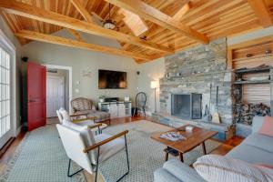 a living room with a stone fireplace at Marlboro Escape 9 Mi to Mount Snow Resort! 