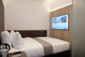 The Z Hotel Shoreditch tesisinde bir odada yatak veya yataklar